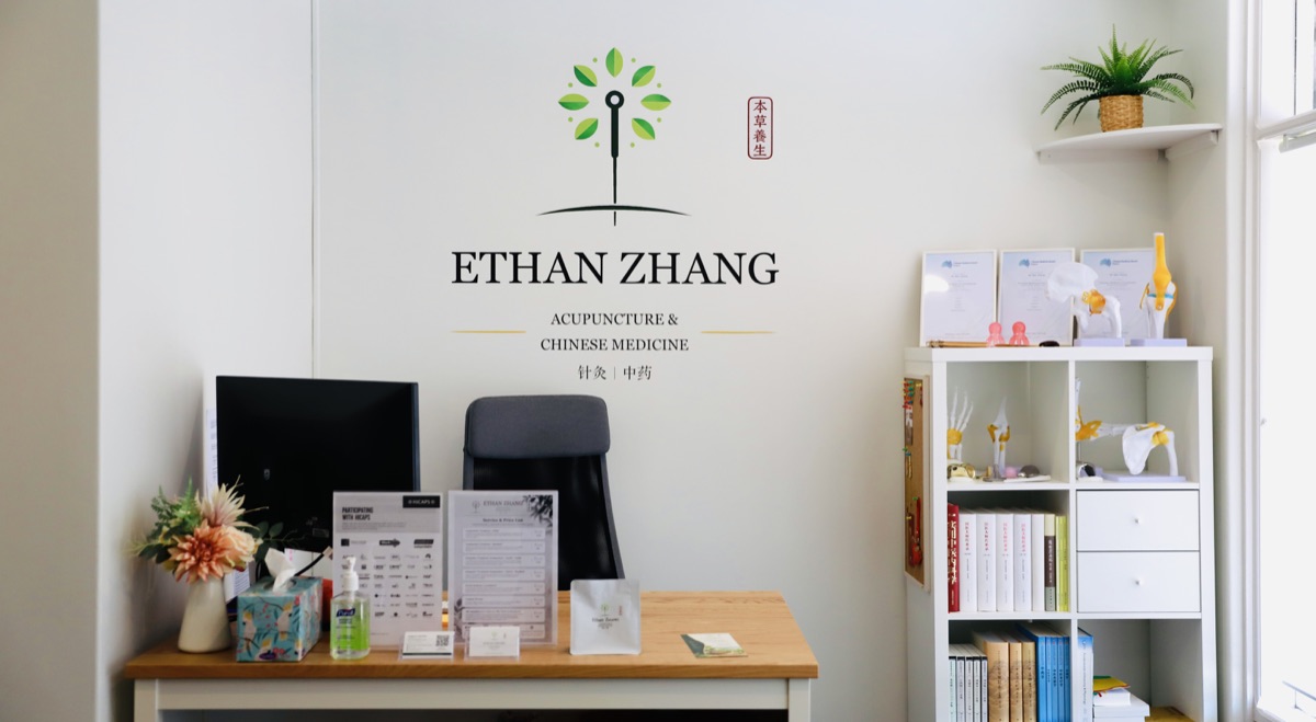 Reception and patient information at Ethan Zhang’s clinic